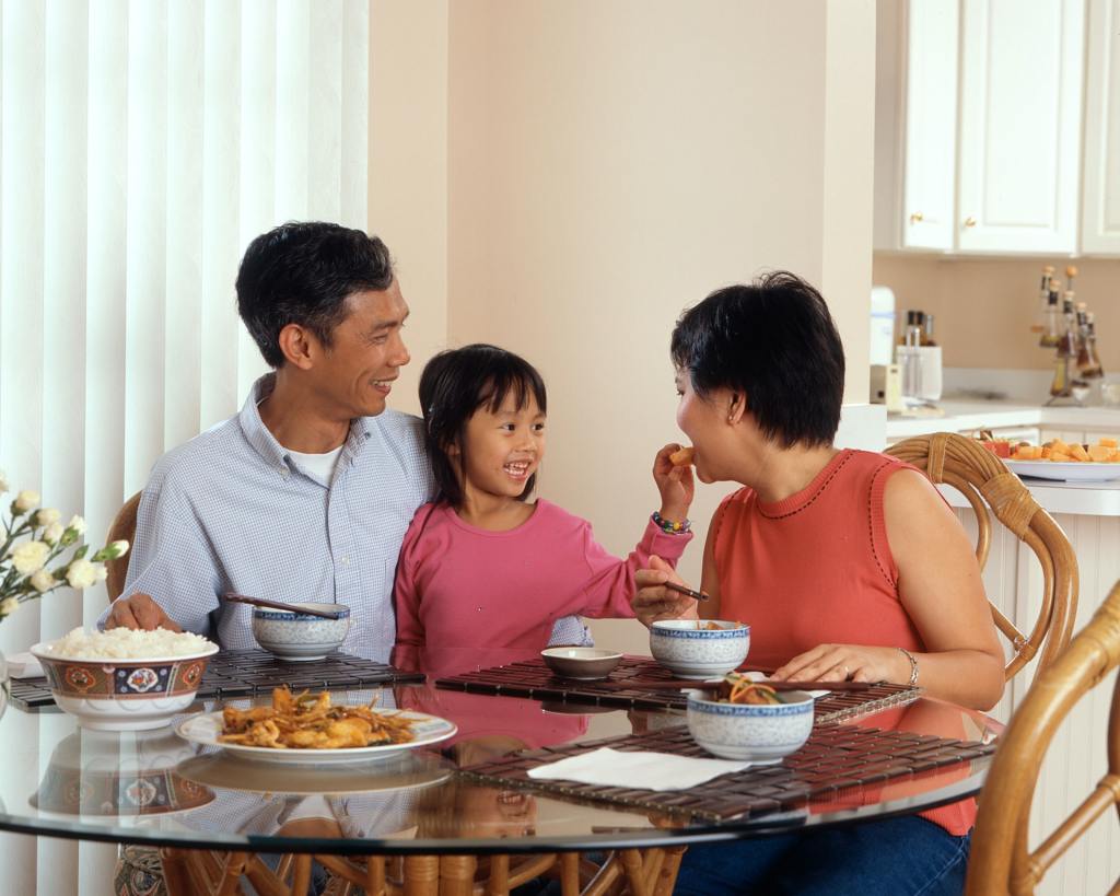 Photo of a family enjoying a meal together.