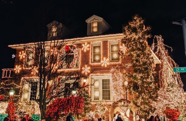 photo of a home decorated with Christmas lights
